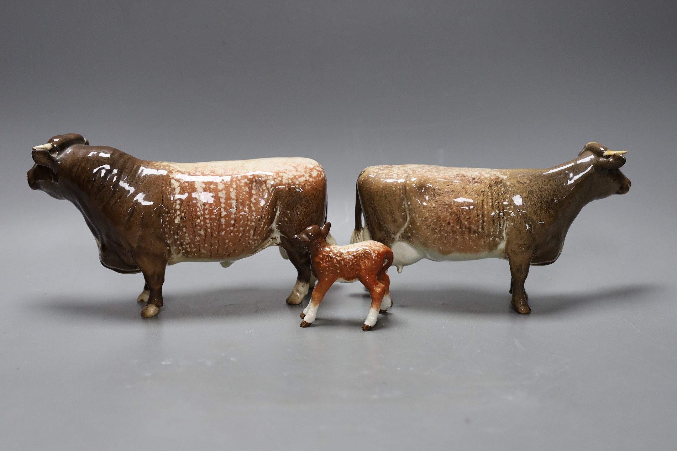 A Beswick Lord Oxford model of a bull, cow and calf